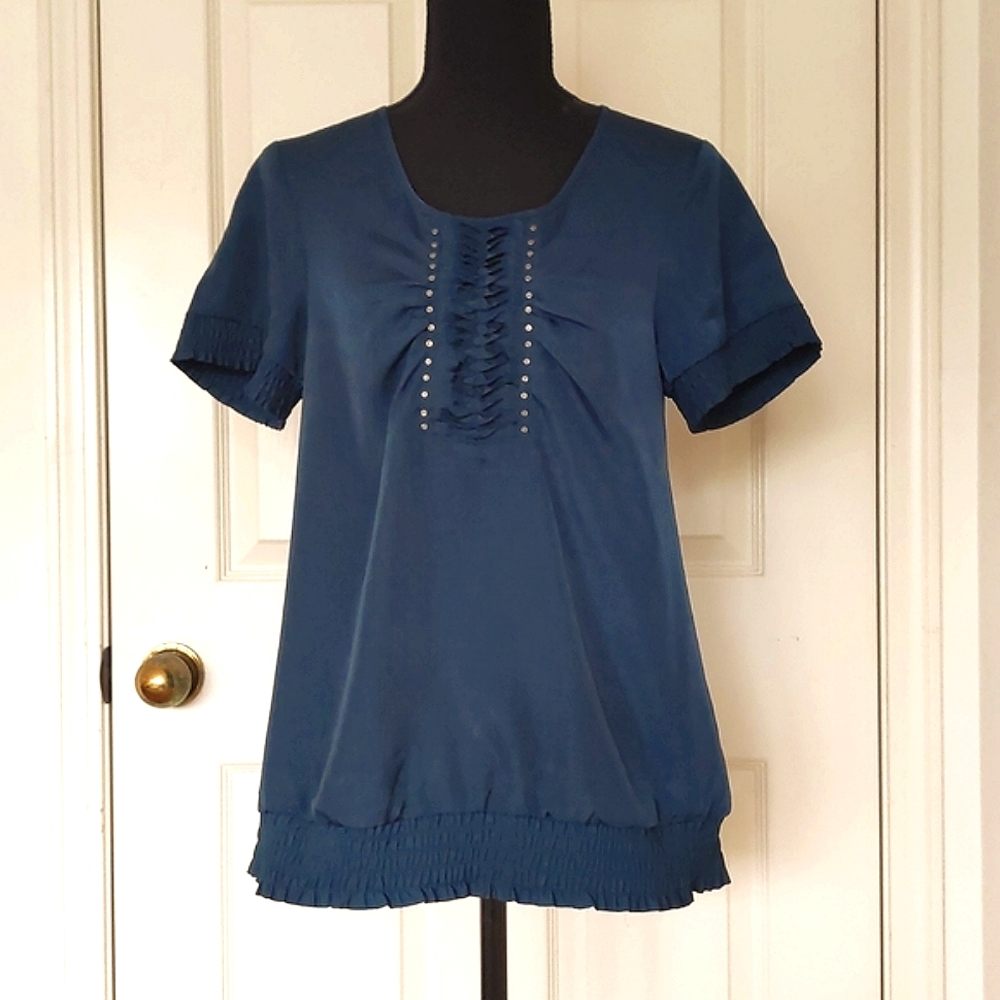 NWT. The Limited Short Sleeve Blouse w/front design and elastic designed edges.